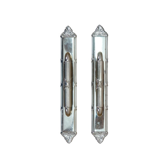 Vintage pair of brass door pull handles with backplate. Neoclassical styling with with ornate scrollwork at the top and...