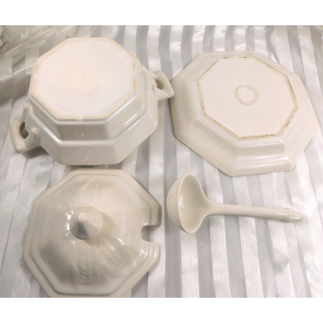 This is an eight sided white soup tureen that is marked Calif, USA, LCS. The underplate is marked Calif, USA and H-53....