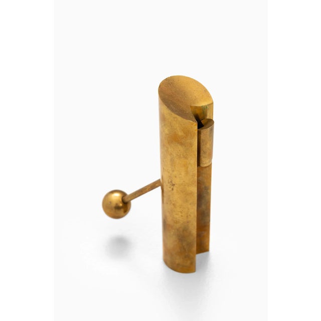 Candlestick in brass model Variabel designed by Pierre Forsell. Produced by Skultuna in Sweden. This piece is attributed...