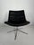 Vintage swivel lounge chair featuring a low, wide scoop-style shell, without armrests, set on a chrome-plated swivel base....