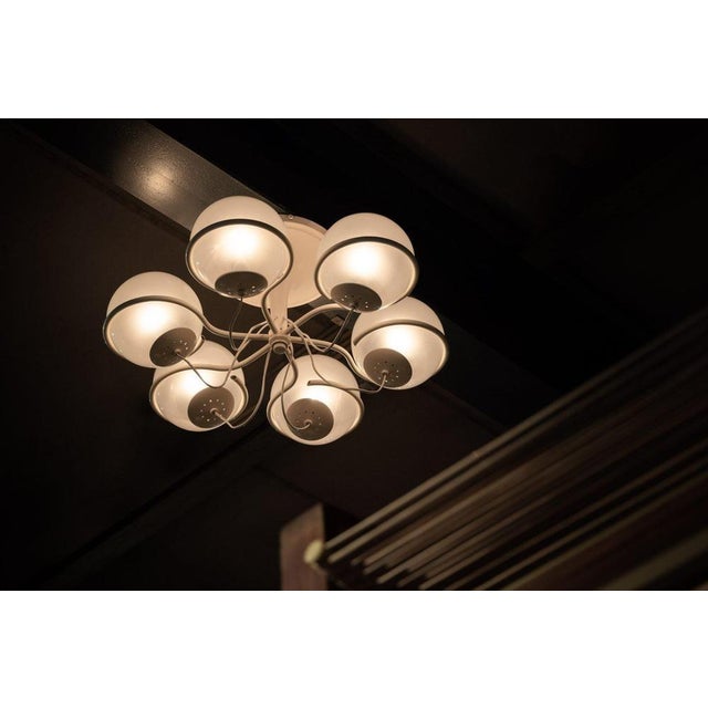 The large ceiling lamp model 2042/6, designed by the legendary Gino Sarfatti and manufactured by Arteluce in Italy in...