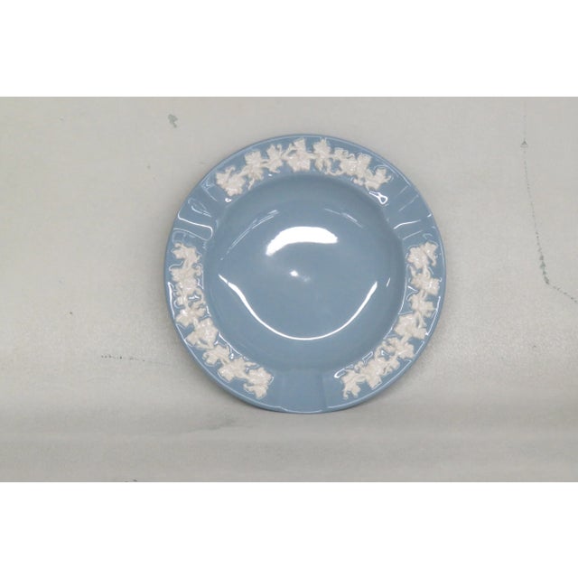 This lovely ashtray / dish is made of ceramic. This piece is stamped as being made by Wedgwood of Etruria and Barlaston in...