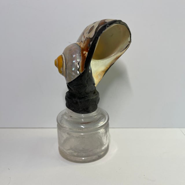 Unusual decorative object. Handmade combination of a vintage Sanford Ink bottle with a spiral shell polished and mounted...