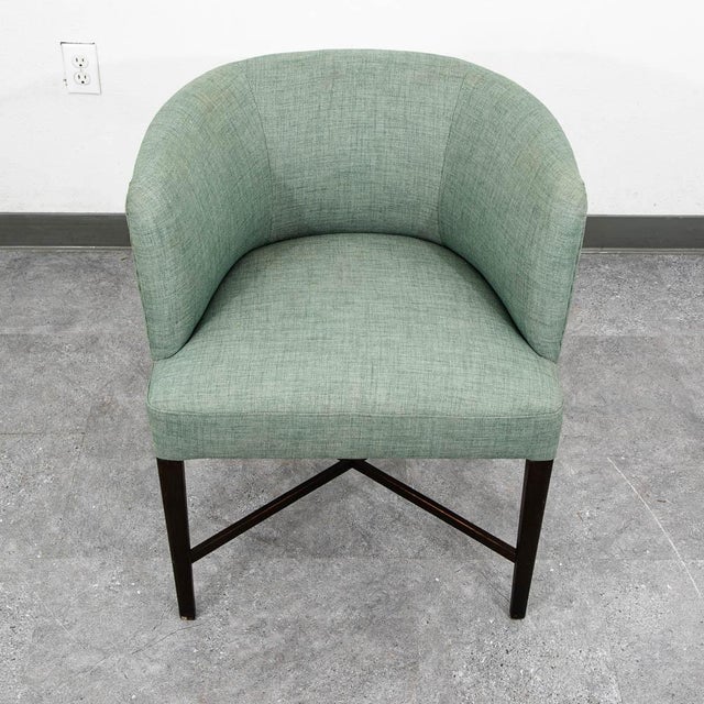 Scandinavian upholstered arm chair in solid wood. upholstered in a green fabric. Recently imported from Denmark.
