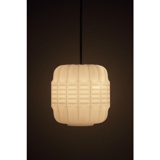 Opaline triplex glass. Made in former Czechoslovakia. No damage to a glass shade. Brass rod and ceiling cover in an...