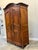 19th C. French Provincial Louis XV style armoire in walnut with foliate carvings on the doors and cornice. These pieces...