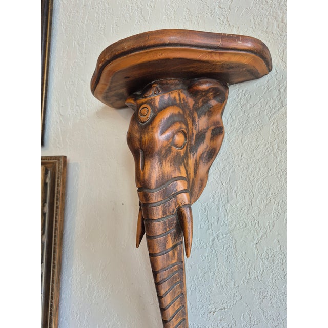 Standout pair of BoHo Chic Anglo Indian Elephant head wall bracketts hand carved mohagany in a stylzed form.