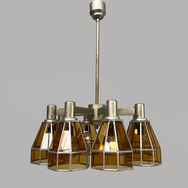 German Art Deco chandelier in yellow glass and metal, 1930s Chandelier with eight yellow glass shades with a metal finish....