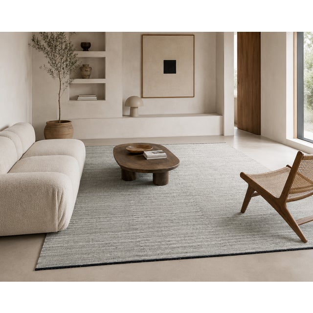 An elegant, hand-knotted contemporary Afghan kilim featuring a sophisticated, minimalist design and delicate shades of...