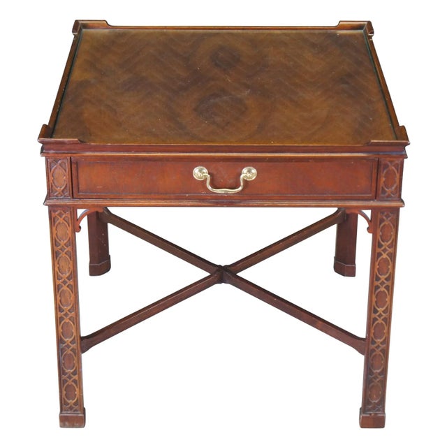 A regal occasional table by Baker Furniture, Circa last quarter 20th century. Inspired by English Georgian & Chinese...