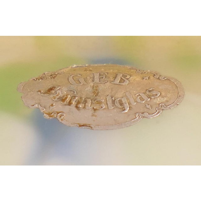 Polished solid brass base, with original, signed, mouth-blown handmade mottled glass shade This piece has an attribution...