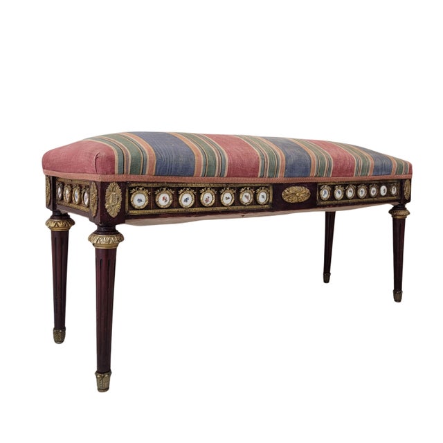 An elegant Louis XVI style bench or chaise lounge, crafted in late 19th-century France from stained beech wood. It...