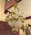 This one-of-a-kind chandelier blends grand sophistication with exquisite detail. Featuring sculpted bronze arms decorated...