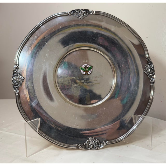 The Vintage 1943 Hollywood mixed doubles silverplate golf trophy charger is a unique and collectible item for golf...