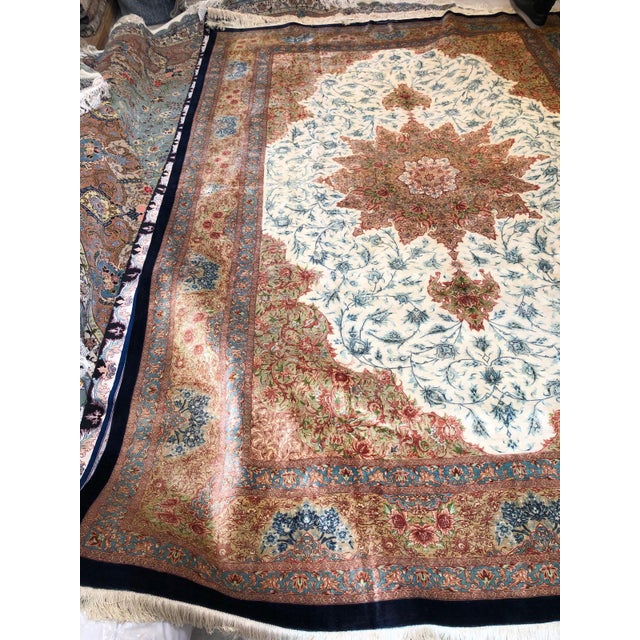 An Exceptional Silk-on-Silk Persian Masterpiece This Persian rug is a rare expression of artisanal excellence, entirely...