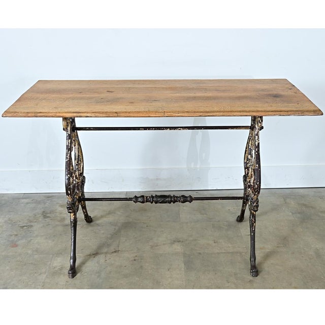 The surface of this French 19th-century tavern table is a unique combination of rustic material and elegant Belle Epoch...