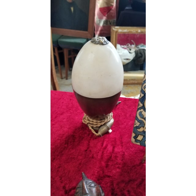 Gorgeous egg-shaped table lamp in brass and opaline glass. This incredibly elegant and unique piece was designed in Italy...