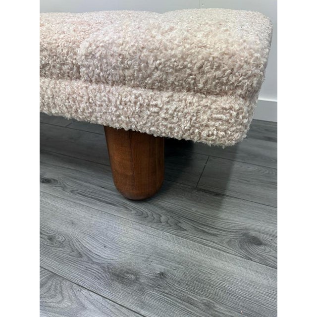 A sensational three seater bench newly upholstered in fine bouclé fabric standing on chunky solid oak legs . Italy C1970-1979