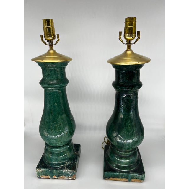 Pair of glazed terracotta green baluster lamps. Circa Late 19th to Early 20th Century