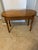 A vintage kidney-shaped wood accent side table, typically crafted from pine or tiger oak. Features a classic curved kidney...