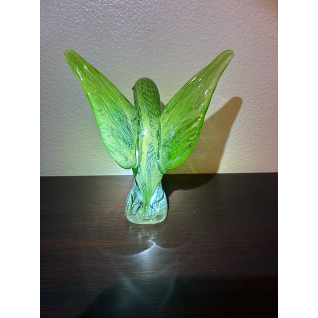 Charming whimsical Murano McCaw bird. The chartreuse to mint green shading is a stand out for parrot lovers. The red beak...