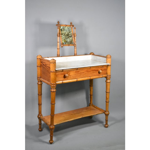 An attractive French faux bamboo washstand dating from the late 19th century, this piece is well-crafted in wood to...