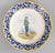 A charming pair of antique French faience Quimper plates, circa 1920. Maker's mark on front and reverse. These collectible...
