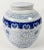 Vintage lidded blue and white Asian ginger jar with lotus root detail to base and lid. Minor age wear. No chips or cracks.