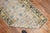 Late 19th century worn East Turkestan Khotan Runner with a pomegranate design in gray, mustard, beige and denim blue...