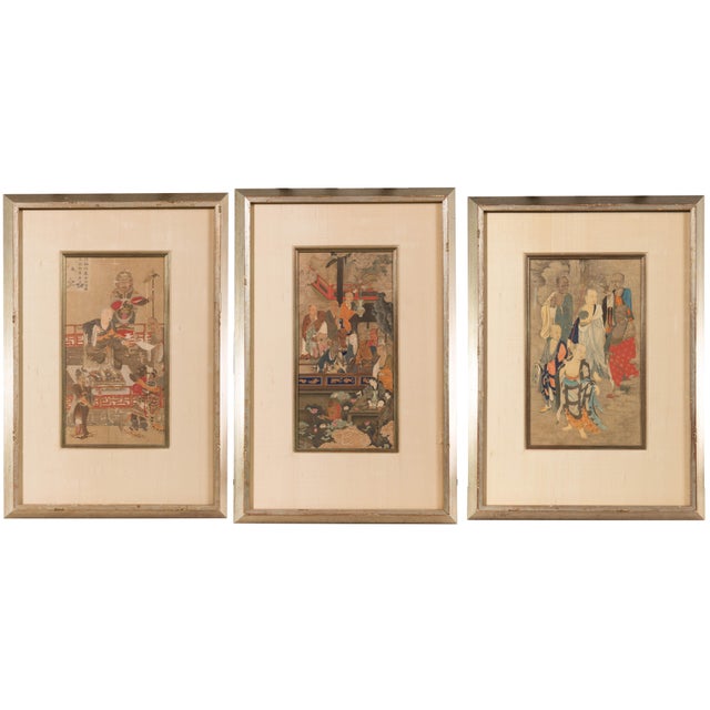 A set of framed Japanese religious prints. Sold as a set of 3. In silver leaf and painted frames with matching filets and...