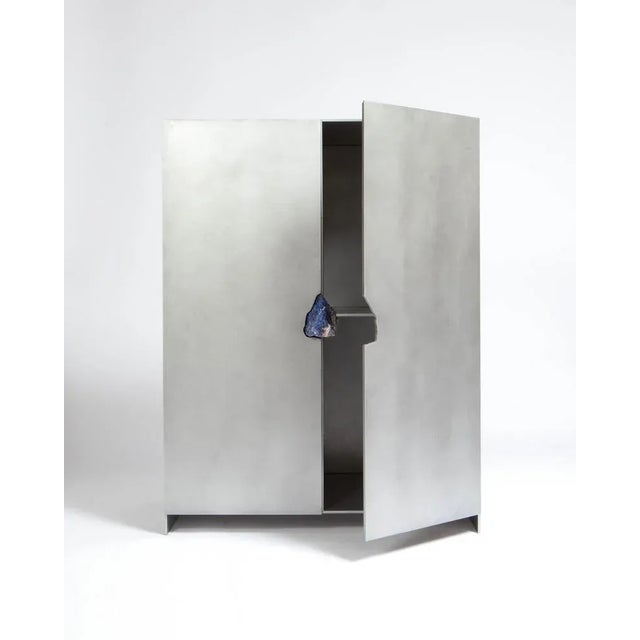 Hand-sculpted cabinet with original Lapis Lazuli - Pierre De Valck. Cabinet with stone (Lapis Lazuli). Oxidized and waxed...
