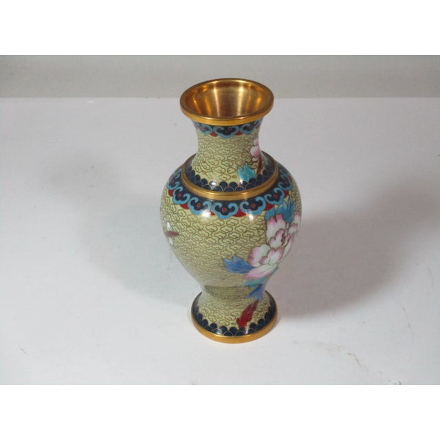 Vintage Chinese cloisonne vase, hand crafted of brass and enamel. Decorated with rose and blue peony's, blue leaves and...