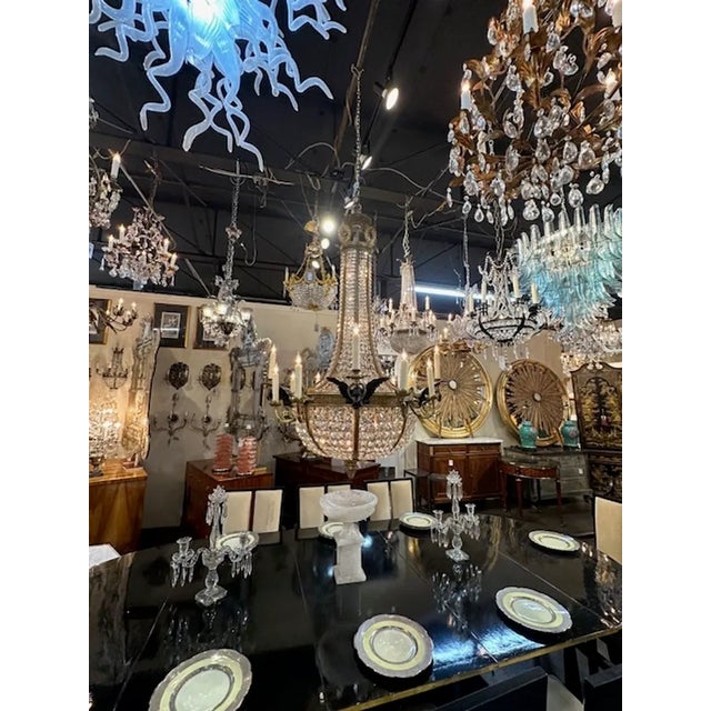 Outstanding late 19th century French Empire gilt bronze and crystal basket chandelier. Circa 1880. The chandelier has been...