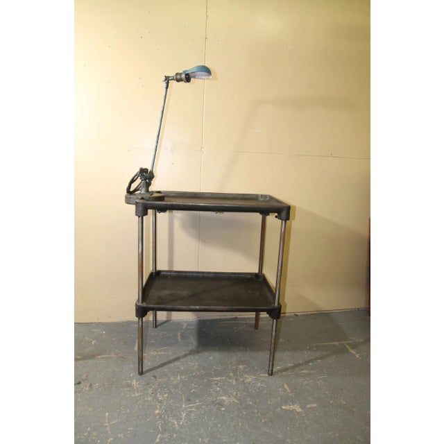 Im pleased to offer this great metal work table with a OC White work light attached to it. These 100 year old plus tables...
