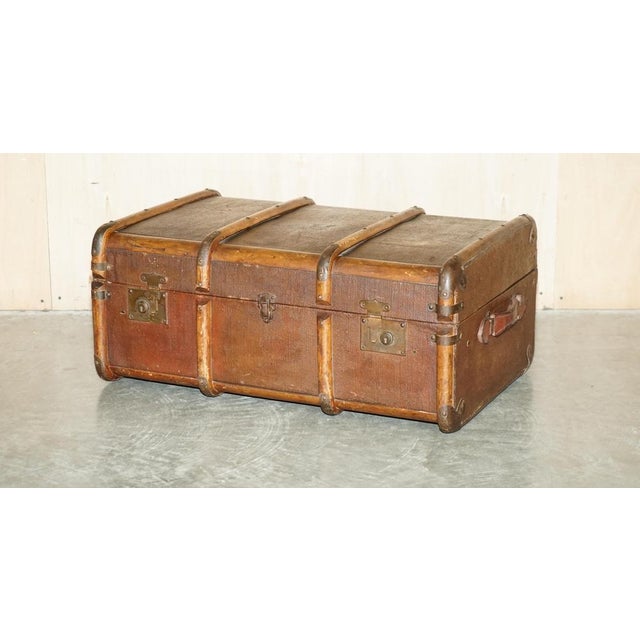 We are delighted to offer for sale this original circa 1880 English Elm strapped with Wrought Iron rivets, leather...