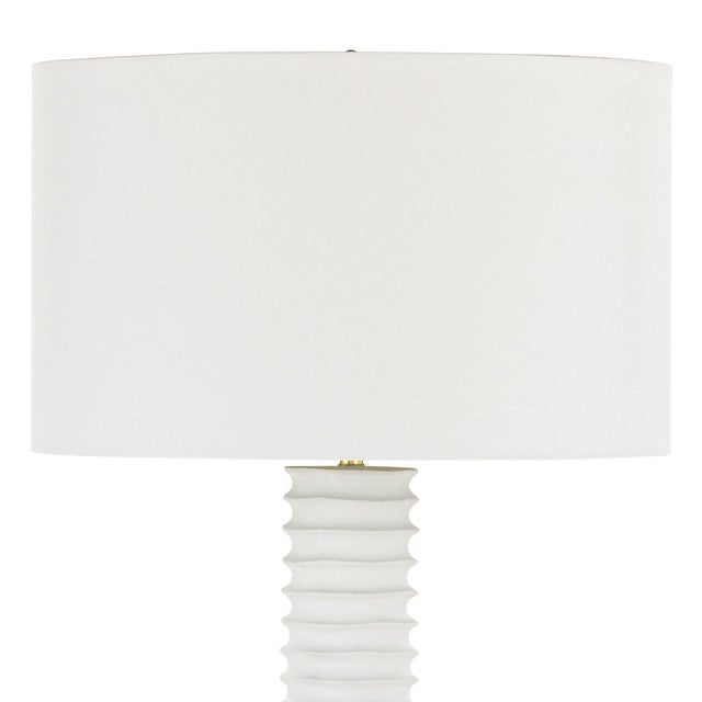 A tactile white finish on the striking Nabu floor lamp accentuates its accordion-like base. Its simple, yet artisan feel...