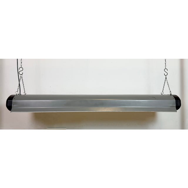 This industrial tube light was made by Elektrosvit in former Czechoslovakia during the 1960s. It features a bakelite body...