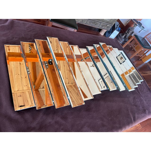 This stunning 1980's Multi Tiered beveled glass paneled wall mirror presents a rare combination of an art object coupled...