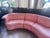Vintage curved sectional sofa from 'Carson's', upholstered in original peach-toned Naugahyde. This sculptural three-piece...