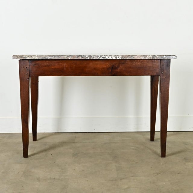 Dimensions: 29 ⅛” H x 45 ⅛” W x 22 ½” D Crafted in France circa 1850, this unique console table would have been a fixture...