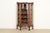 An exceptional antique Victorian or American Empire bookcase, dining cabinet, or display cabinet In the manner of R.J....
