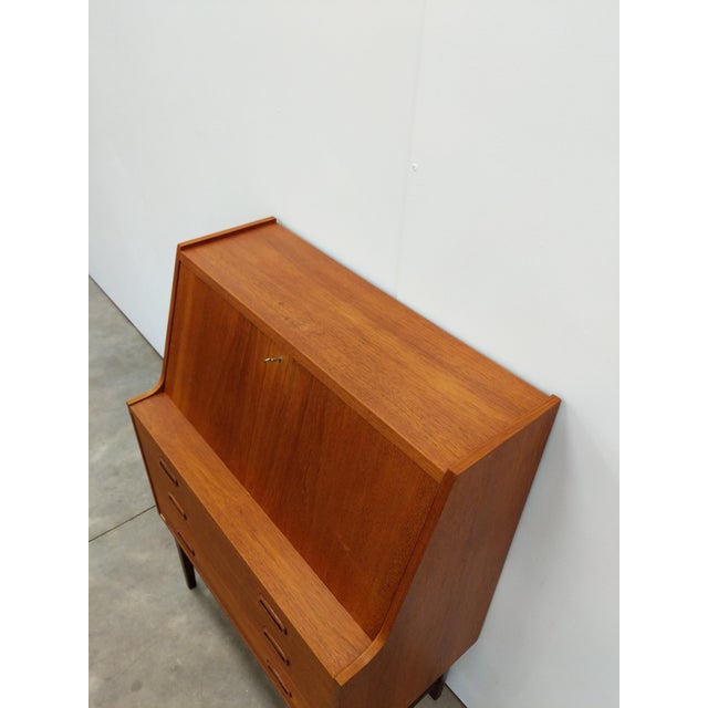 Authentic vintage mid century modern teak secretary desk / cabinet. This piece is in excellent condition with few signs of...