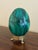 A stunning Russian style large malachite egg on Neoclassical style stand with paw feet Late 20th century Solid malachite...