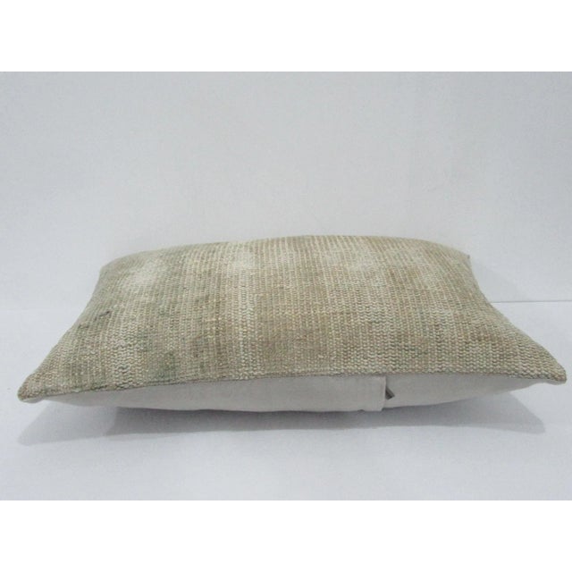 Decorative pillow cover made from a vintage Turkish handknotted rug. Backed with good quality cotton fabric. Pillow...