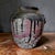 A Japanese glazed vessel from the Edo period. Made in the Tanba area since the 12th century, these ceramic and stoneware...