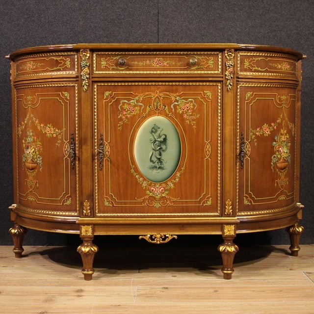 Italian sideboard from the second half of the 20th century. Beautifully crafted and high-quality furniture in carved,...