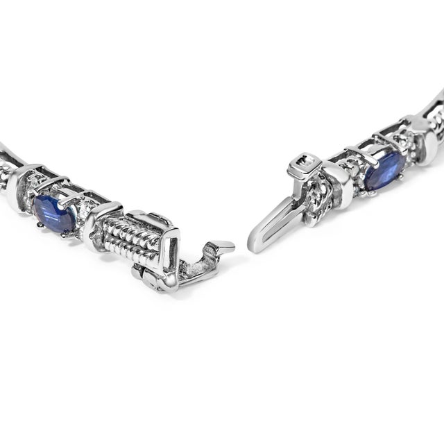 Bathe in the resplendent allure of this exquisitely crafted bracelet, forged from luminous 14K white gold and rhodium-...
