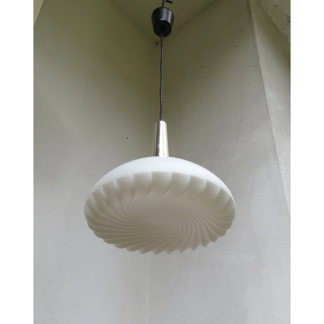 An unusual ceiling lamp in "Psychedelic" or Op-Art by Peill & Putzler from the 70s. The lampshade is made of satin white...