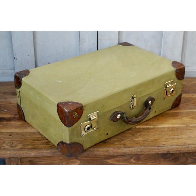 An original pukka military demob case. Made from canvas with leather corners and handle and original brass locks. The...