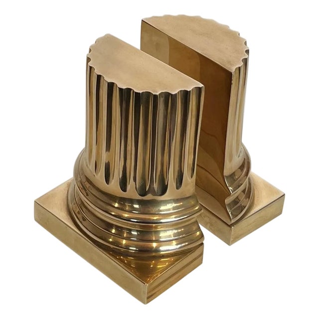 Pair of brass bookends representing columns For Sale